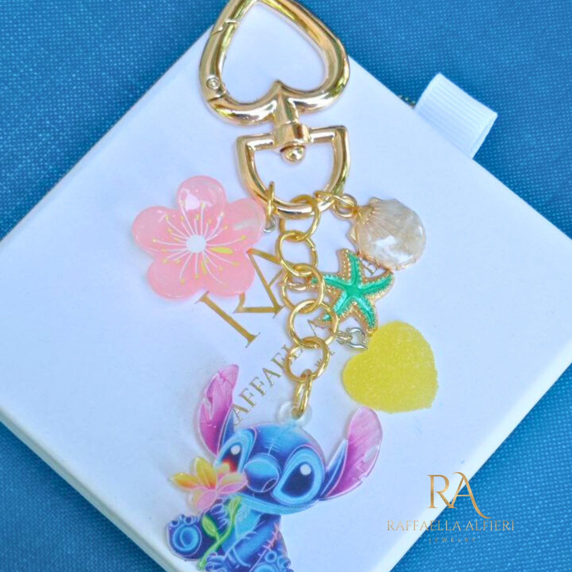 Portachiavi Stitch e Angel Disney con conchiglie dorate e stelle marine - Ciondolo per borsa Lilo & Stitch"