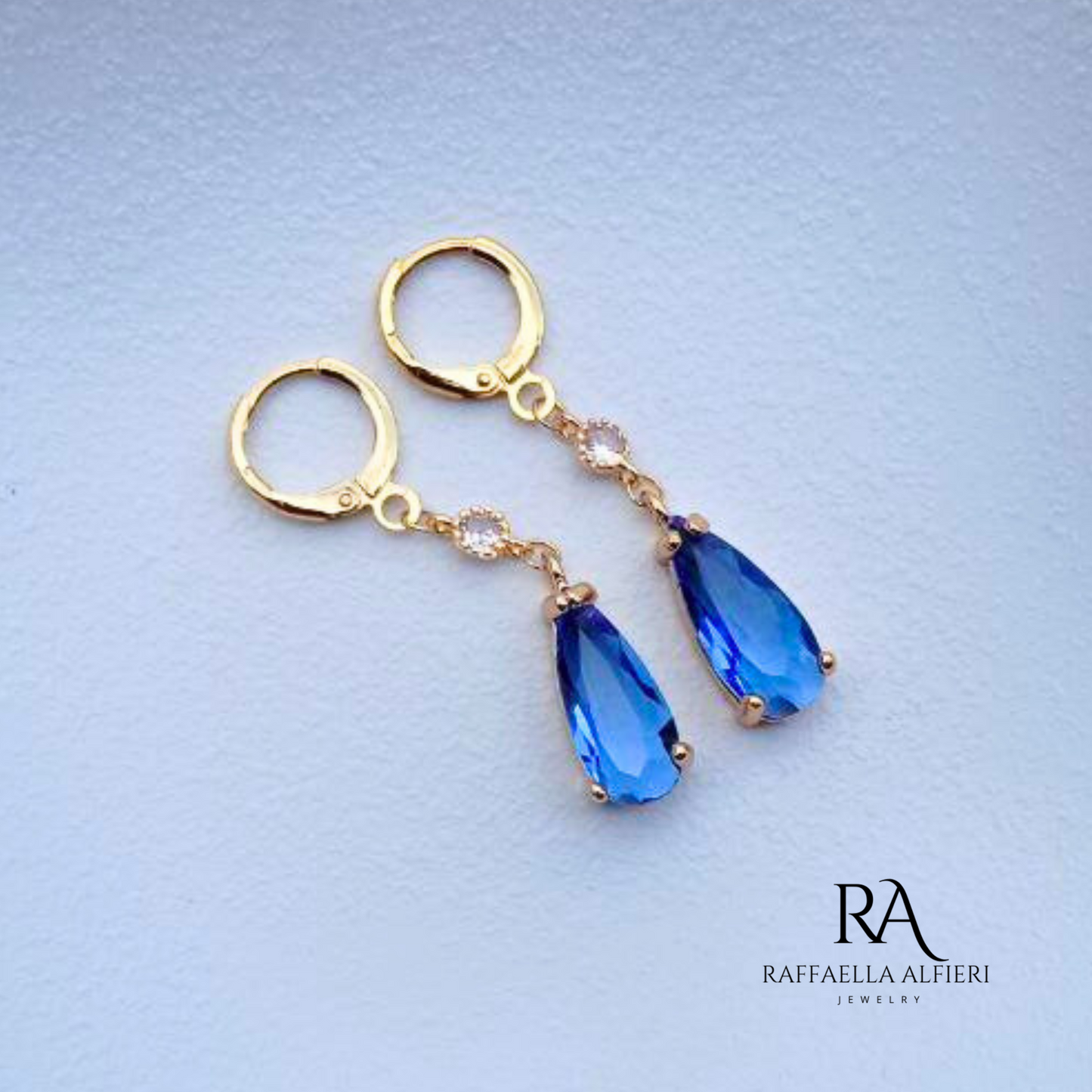 Blue Crystal Earrings Gold Plated Copper Statement Piece Fantasy Style Design Elegant Drop Shape Formal Occasion Jewelry Special Event Accessory Leverback Closure Premium Quality Construction Modern Fashion Collection Unique Artistic