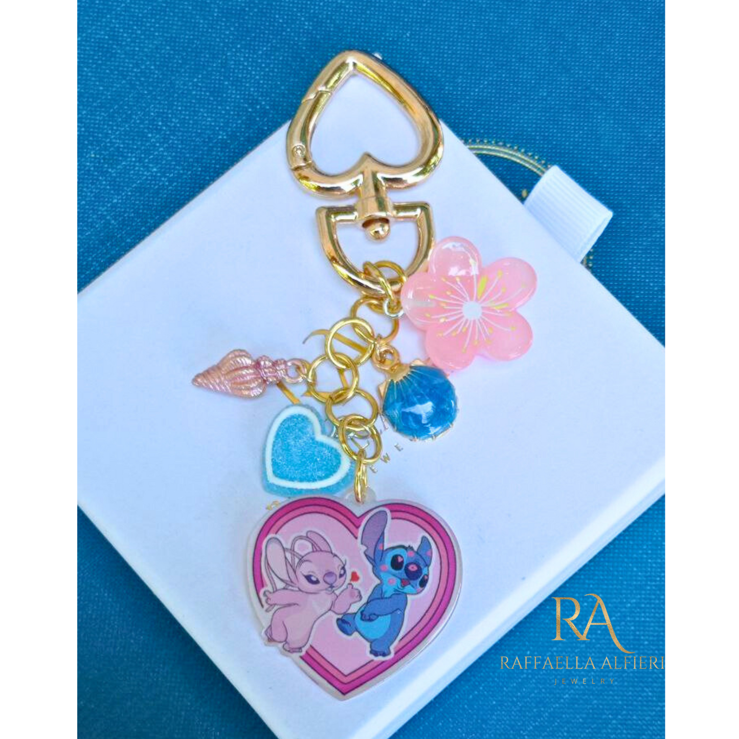 Portachiavi Stitch e Angel Disney con conchiglie dorate e stelle marine - Ciondolo per borsa Lilo & Stitch"