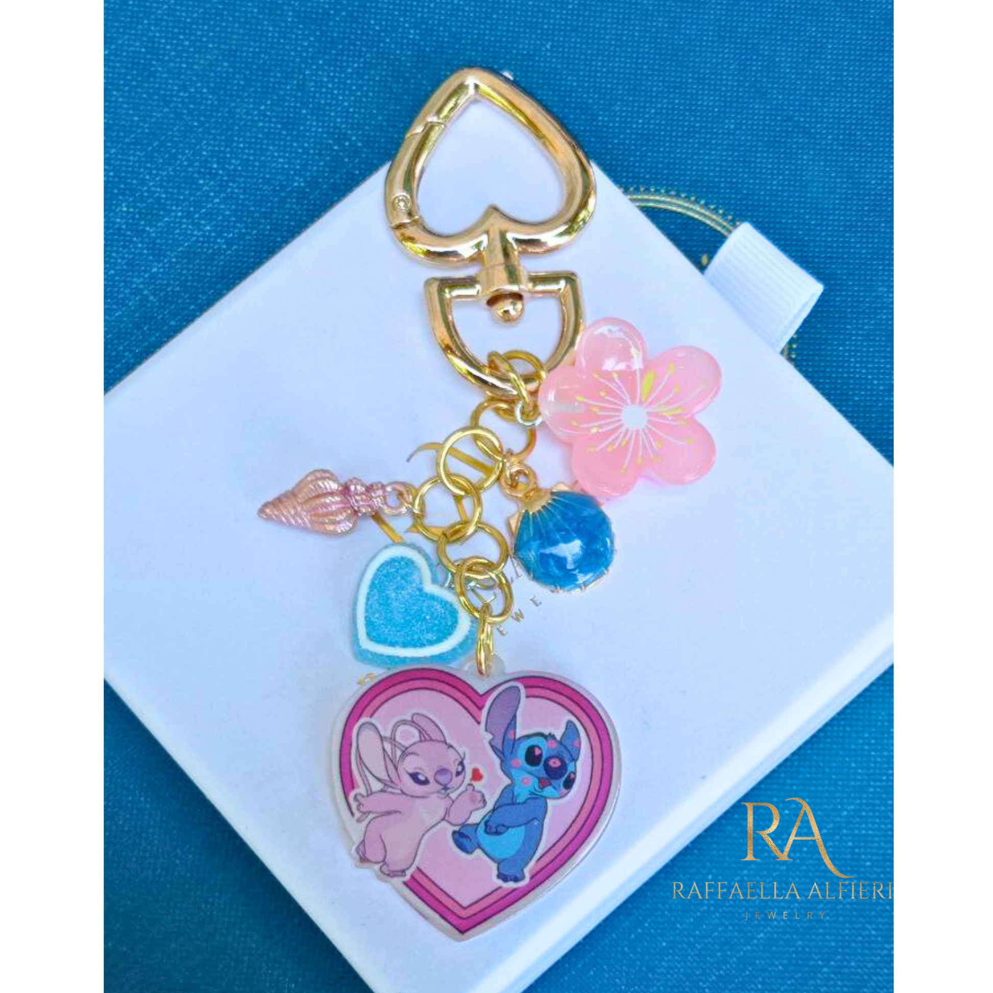 Portachiavi Stitch e Angel Disney con conchiglie dorate e stelle marine - Ciondolo per borsa Lilo & Stitch"